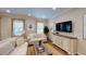 Bright living room with recessed lighting, a sofa, and a stylish console table at 2050 1St Ave, Deland, FL 32724