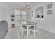 Dining area featuring an oval wooden table, seating for six, and stylish light fixture at 2136 Crofton Ave, Davenport, FL 33837