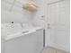 Functional laundry room with a washer, dryer, storage shelf and access door at 2136 Crofton Ave, Davenport, FL 33837