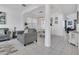 Inviting living room and dining room featuring archways, tile flooring, and neutral decor at 2136 Crofton Ave, Davenport, FL 33837