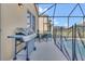 Outdoor patio area featuring a stainless steel grill and a cozy dining set for al fresco meals and relaxation at 2136 Crofton Ave, Davenport, FL 33837