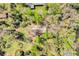 Aerial view of a home surrounded by lush trees, providing a private and natural setting at 220 Wekiva Park Drive, Sanford, FL 32771