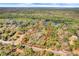 Aerial view of the property outlined in red, showcasing the land and surrounding greenery at 220 Wekiva Park Drive, Sanford, FL 32771