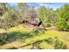 Aerial view of home and yard surrounded by trees at 220 Wekiva Park Drive, Sanford, FL 32771