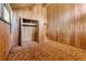 Bedroom featuring wood paneling, carpet, and a closet with opened doors at 220 Wekiva Park Drive, Sanford, FL 32771
