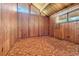 View of the bedroom featuring wood paneling and lots of natural light at 220 Wekiva Park Drive, Sanford, FL 32771