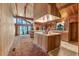 Spacious kitchen with vintage appliances and ample cabinetry, featuring an island and vaulted ceilings at 220 Wekiva Park Drive, Sanford, FL 32771