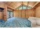 Spacious living room with vaulted wood ceilings and a large sliding glass door at 220 Wekiva Park Drive, Sanford, FL 32771