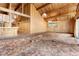 Living area featuring wood paneling, high ceilings, and outdated carpeting at 220 Wekiva Park Drive, Sanford, FL 32771