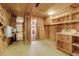 Utility room featuring a sink, shelving, and a hot water heater at 220 Wekiva Park Drive, Sanford, FL 32771