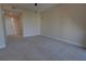Bedroom with neutral carpet, with view into hall at 225 W Seminole Blvd # 213, Sanford, FL 32771