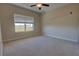 Bedroom with neutral carpet, ceiling fan and large window at 225 W Seminole Blvd # 213, Sanford, FL 32771