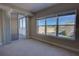 Bright bedroom featuring large windows with blinds and a sliding glass door leading to a balcony at 225 W Seminole Blvd # 213, Sanford, FL 32771
