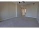 Bedroom with neutral carpet, with view into hall at 225 W Seminole Blvd # 213, Sanford, FL 32771