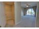 Bedroom view showcasing a walk-in closet and sliding glass doors to the balcony at 225 W Seminole Blvd # 213, Sanford, FL 32771