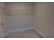 Inside view of the bedroom closet, featuring carpet and wire shelving at 225 W Seminole Blvd # 213, Sanford, FL 32771