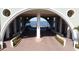 An impressive entrance archway of the building with a brick drive and mature landscaping at 225 W Seminole Blvd # 213, Sanford, FL 32771