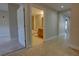 Bright hallway leads to a bathroom with tiled floors, and updated vanity at 225 W Seminole Blvd # 213, Sanford, FL 32771