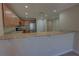 Kitchen featuring stainless steel appliances, light brown cabinets, and breakfast bar at 225 W Seminole Blvd # 213, Sanford, FL 32771