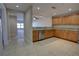 The kitchen features tiled floors, granite counters, and stainless steel appliances at 225 W Seminole Blvd # 213, Sanford, FL 32771