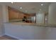 Kitchen with granite countertops, stainless steel appliances, and light brown cabinets at 225 W Seminole Blvd # 213, Sanford, FL 32771