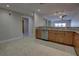 Open kitchen with granite countertops and stainless steel dishwasher overlooks the living area at 225 W Seminole Blvd # 213, Sanford, FL 32771