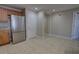 Kitchen featuring stainless steel appliances, light brown cabinets, and tiled floor at 225 W Seminole Blvd # 213, Sanford, FL 32771