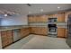 Bright kitchen boasts stainless steel appliances, granite countertops and light brown cabinets at 225 W Seminole Blvd # 213, Sanford, FL 32771