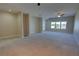 Spacious living room with carpet and large windows for natural light at 225 W Seminole Blvd # 213, Sanford, FL 32771