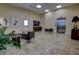 Lobby with tiled floor, comfortable seating, and elevator access at 225 W Seminole Blvd # 213, Sanford, FL 32771