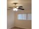 Bedroom featuring a ceiling fan, wood-look flooring, and a window with blinds at 2548 Oak Park Way # 102, Orlando, FL 32822