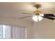 Close-up of a stylish ceiling fan with integrated lighting, adding charm to any room at 2548 Oak Park Way # 102, Orlando, FL 32822