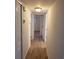Bright hallway with multiple doors, offering access to various rooms and ample natural light at 2548 Oak Park Way # 102, Orlando, FL 32822
