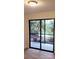 Sliding glass doors opening to an outdoor patio with lake views at 2548 Oak Park Way # 102, Orlando, FL 32822