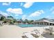 Enjoy this community pool with lounge chairs and a covered area for relaxing by the water on hot days at 2548 Oak Park Way # 102, Orlando, FL 32822