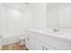 Bathroom with white vanity, tub, shower, and neutral flooring at 2917 Wild Olive Dr, St Cloud, FL 34772