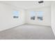 Spacious bedroom with plush carpet, recessed lighting and bright window views at 2917 Wild Olive Dr, St Cloud, FL 34772