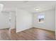 Bright bedroom with wood-look tile flooring and a window view at 2917 Wild Olive Dr, St Cloud, FL 34772
