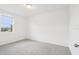 Bright bedroom with plush carpet and a window with a neighborhood view at 2917 Wild Olive Dr, St Cloud, FL 34772