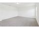 Spacious bedroom with neutral carpet, white walls, and a window at 2917 Wild Olive Dr, St Cloud, FL 34772