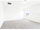 Bright bedroom featuring neutral carpet, white walls, and a sunlit window at 2917 Wild Olive Dr, St Cloud, FL 34772