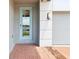 Close-up of the front entrance, featuring brickwork and a light blue door at 2917 Wild Olive Dr, St Cloud, FL 34772