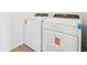 Laundry room with Whirlpool washer and dryer and vinyl flooring at 2917 Wild Olive Dr, St Cloud, FL 34772