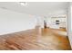 Open-concept space with wood-look tile floors joining the kitchen and living areas at 2917 Wild Olive Dr, St Cloud, FL 34772