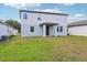 This home has a serene backyard with a covered patio, perfect for entertaining at 2925 Wild Olive Dr, St Cloud, FL 34772