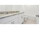 Bathroom featuring single sink with granite countertop at 2925 Wild Olive Dr, St Cloud, FL 34772