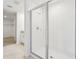 Bathroom showcasing a glass shower and neutral tile at 2925 Wild Olive Dr, St Cloud, FL 34772