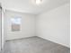 Cozy bedroom showcasing natural light through a window and neutral carpeting at 2925 Wild Olive Dr, St Cloud, FL 34772