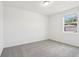 Cozy bedroom with carpet, a window for natural light, and neutral walls at 2925 Wild Olive Dr, St Cloud, FL 34772
