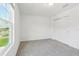 Bright bedroom featuring a neutral color scheme and a closet for storage at 2925 Wild Olive Dr, St Cloud, FL 34772